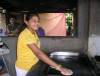 Cindy Hernandez working as a tortilla maker
