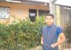 Cristian Hernandez in front of Juan Avelar School