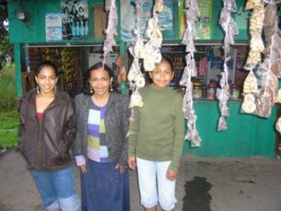 Dunia Bonilla with family at their home and street store